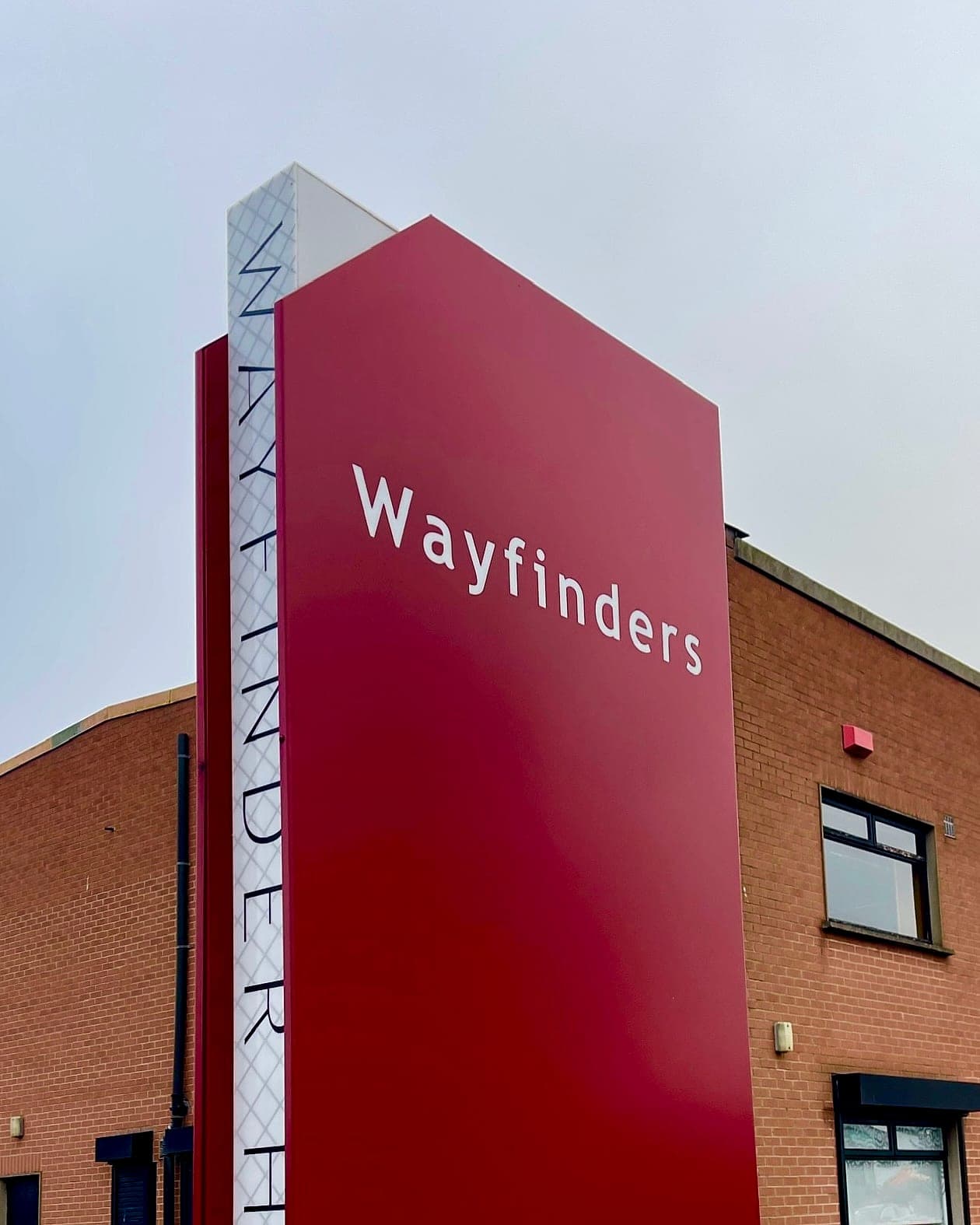 Wayfinders HQ: mixed-case and letterspaced capital lettering on the Wayfinders totem sign outside the company's Dublin headquarters